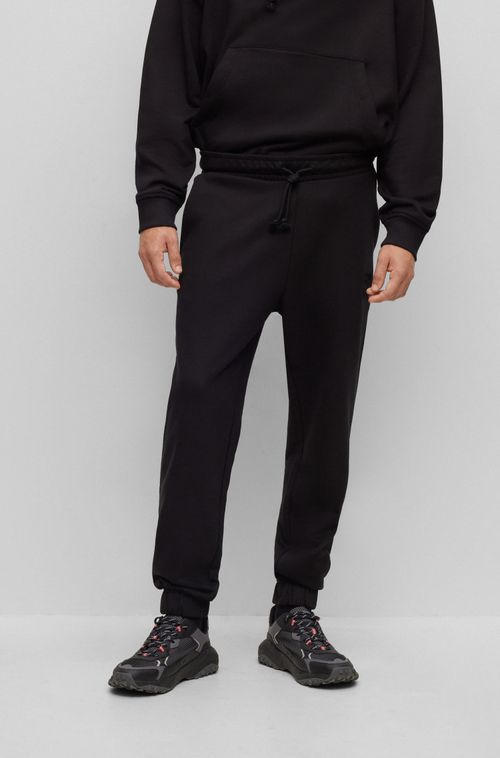 Calça Tracksuit Preta Relaxed-Fit Em Algodão Terry Com Logo Estilizado